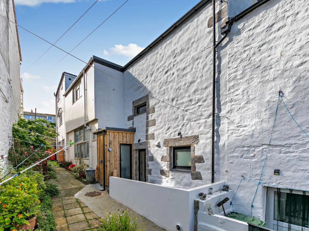 Enclosed rear courtyard and wooden porch at Night's Catch